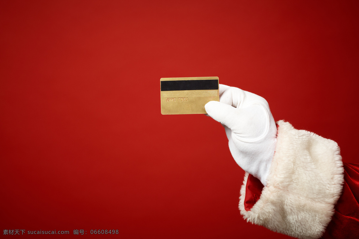 信用卡 手 老人 圣诞老人 银行卡 红色背景 白色手套 节日庆典 生活百科